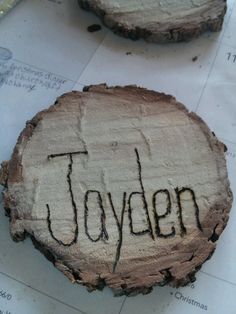 two pieces of wood with the word joyden written on them, sitting next to each other