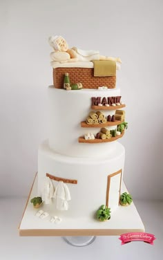 a three tiered cake with lots of different items on it