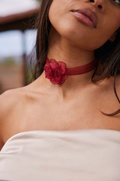 All eyes on you in Genesis. This red-lace statement choker is super cute (I mean, just look at her) but practical too, ready to take any look up a notch. Don’t be surprised if you hear, “where’d you get that?” a lot. **ALL ACCESSORIES ARE FINAL SALE** PRODUCT DESCRIPTION - red rosette choker - sheer ribbon material - length: 12.5” + 2” extension MATERIALS AND CARE INSTRUCTIONS - 90% polyester, 10% iron - jewels are dainty and delicate pieces that should be handled with care and caution - avoid s Red Flower Choker, Rosette Choker, Ribbon Choker, Deodorant Stains, Flower Choker, Chain Belts, Statement Choker, Emerald Color, We Made It