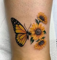 a yellow butterfly and sunflowers on the ankle with dots around it's wings