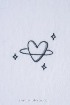 a drawing of a heart in the sky with stars around it and an arrow drawn on paper