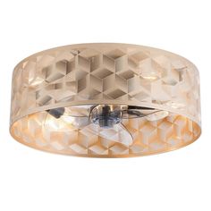 a ceiling light that is made out of metal and has geometric designs on the surface