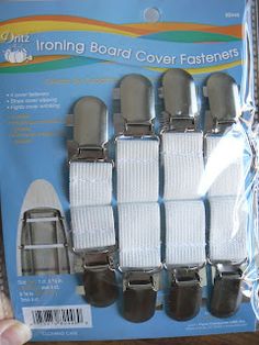 an unopened package of white and gray boat covers for boats with black buckles