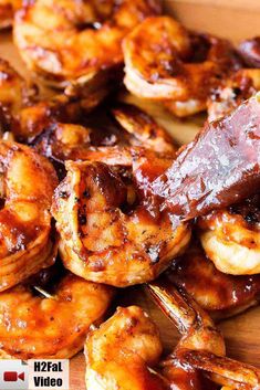 grilled shrimp with bbq sauce on a cutting board