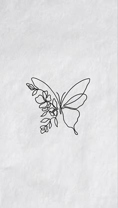 a black and white drawing of a butterfly on a sheet of paper with the outline of a flower