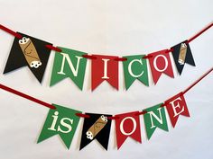 a banner that says nico is one on it