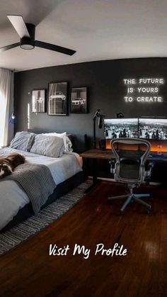 a bedroom with a bed, desk, and chair in front of a wall that says the future is yours to create