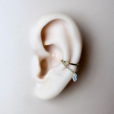 * Size in the main photo is 10mm conch Marquise CZ gold.  Available in the following finish.  Implant grade titanium in silver or gold.  Gauge: 16 or 18g Diameter: 6mm, 8mm, 10mm, 12mm Sold as single. I ship worldwide. Hanging Helix Piercing, Cute Conch Piercing, Conch Piercing Aesthetic, Floating Helix Piercing, Conch Hoop Piercing, Conch Piercing Hoop, Conch Chain, Hoops With Charms, Conch Earrings