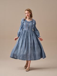 "This ruffled linen midi dress is full of romance and whimsy. This stunning linen dress in MidnightBlue uses ancient tie-dye techniques to create a unique gradient effect that gently unfolds into a cloud-like pattern. It's sure to turn heads! Flattering ruffles paired with soft pintucks add an elegant feminine touch and speaks to romantic nights dancing under a star studded sky or long lunches in the garden with friends.  Carefully crafted cutout details at the front and back create a mysterious and alluring atmosphere. Whether you choose a classic and timeless white dress or a bold and vibrant MidnightBlue hue, you'll fall in love. Note: No two patterns are alike, due to the nature of the hand-dyeing process. 【Fabric】 Main: 100% linen, around 200g/gram. Medium weight. Lace: 100% cotton. a Fairy Dress Long, Ruffle Linen, Dress Fairy, Tie Dye Techniques, Long Sleeved Dress, Elegant Feminine, Linen Midi Dress, Sleeved Dress, Fairy Dress