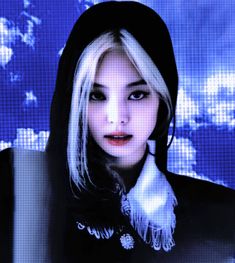 a woman with white hair wearing a black hat and scarf in front of a blue background