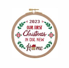 a cross stitch christmas ornament with the words, 2013 our first christmas in our new home