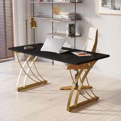 a desk with a laptop on it in front of a bookshelf and shelves