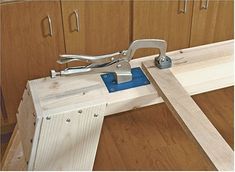 a pair of pliers are being used to make a bench