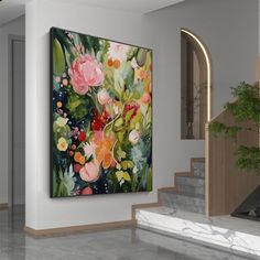 a painting hanging on the wall next to a stair case in a room with marble floors