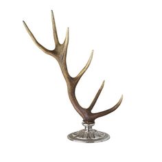 an antlers head on top of a metal stand