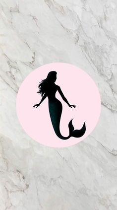 the silhouette of a mermaid on a pink circle with white and black marble flooring