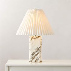 a marble lamp sitting on top of a white table