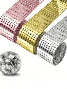 shiny disco balls and ribbons on a white background