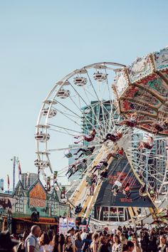 the carnival rides are crowded with people