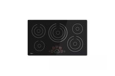 a black stove top with four burners