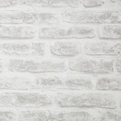 a white brick wall that is very textured and looks like it could be used as a background