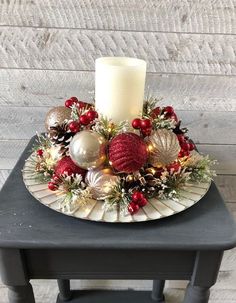 a table with a candle and ornaments on it