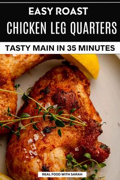 easy roast chicken leg quarters on a white plate with lemon wedges and parsley