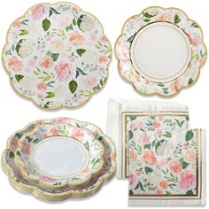 four plates and two napkins with flowers on them, one has a gold rim