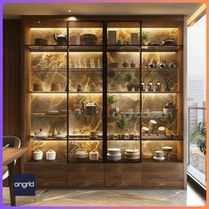 a glass display case filled with lots of pots and pans next to a window