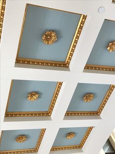 the ceiling is decorated with gold and blue paint