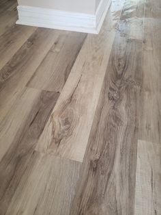 a wood floor that has been cleaned and is in the process of being installed