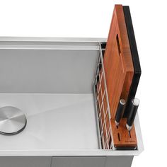 a stainless steel sink with a wooden cabinet in the middle