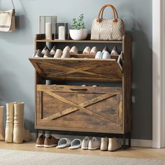 a wooden shoe rack with many pairs of shoes on it and a handbag next to it