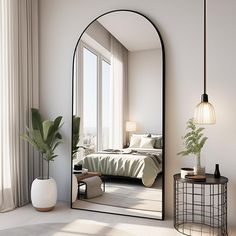 a bedroom with a large mirror on the wall and a bed in the corner next to it