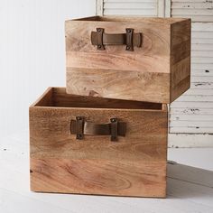 two wooden boxes stacked on top of each other