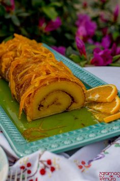 a pastry with orange slices on a green plate