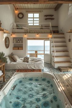 an indoor jacuzzi tub in the middle of a room with stairs leading up to it