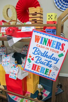 a birthday party with lots of prizes and signs