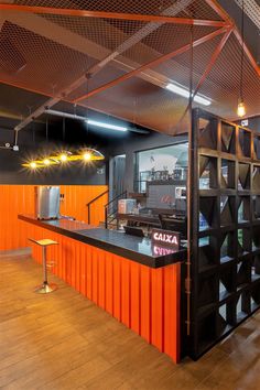 an orange and black restaurant with lots of counter space