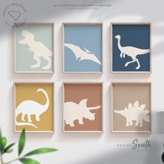 four framed dinosaurs in pastel colors against a white wall with a plant on the side