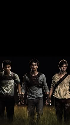 the walking dead season 3 poster with three young men standing in tall grass and one is holding