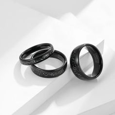 two black rings sitting next to each other