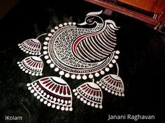 an intricately designed design on the floor in a room with black and white walls