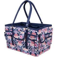 a large blue and pink bag with floral designs on the front, two zippered handles