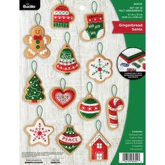 an assortment of christmas ornament ornaments on a white wooden background with green and red trim