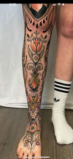 a person with tattoos on their legs and feet