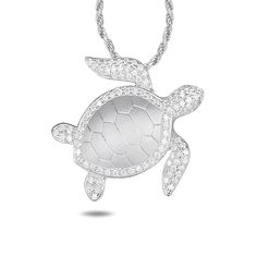 Alamea Sterling Silver CZ Turtle Pendant with Chain Necklace In Hawaii, the sea turtle is a symbol of good luck and protection. This beautiful sterling silver turtle pendant design from Alamea features sparkling CZ accents and comes with a cable chain so it's ready to wear right out of the box. Pendant measures approx. 15/16"L x 15/16"W Cable chain necklace measures approx. 16"L with 1" extender Stamped .925 Sterling silver turtle pendant has round, clear CZ accents Rhodium-plated Lobster-claw c Silver Sterling Silver Turtle Jewelry, Silver Turtle Jewelry For Gifts, Silver Turtle Jewelry Gift, Silver Turtle Jewelry, Silver Turtle Necklace For Gift, Elegant Sterling Silver Turtle Jewelry, Elegant Silver Turtle Jewelry, Diamond Eyes, Turtle Pendant