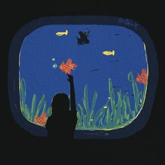 a girl is looking out the window at fish