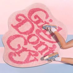 a woman laying on top of a rug with the words go crazy written in it