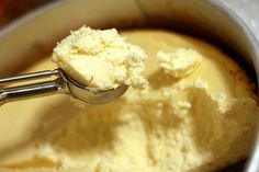 a scoop of ice cream in a bowl with a spoon sticking out of the top